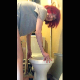 A girl with red dyed hair stands precariously over her toilet while spreading her ass cheeks and taking a shit. Presented in 720P vertical HD format. Over 1.5 minutes.